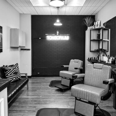 Black-and-white photograph of the Tonsorium barbershop interior in Cedar Knolls, New Jersey